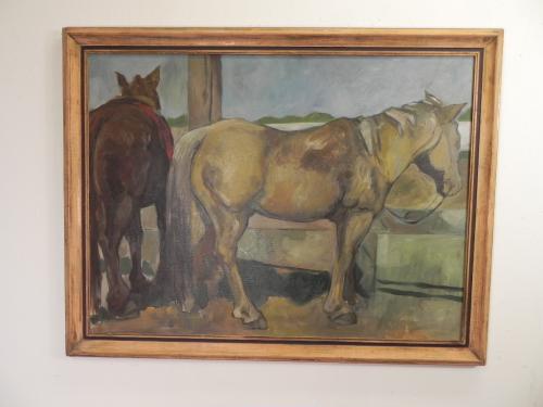 large oil painting of two horses tied tp a fence